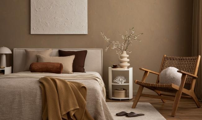 a bedroom with a bed and a chair