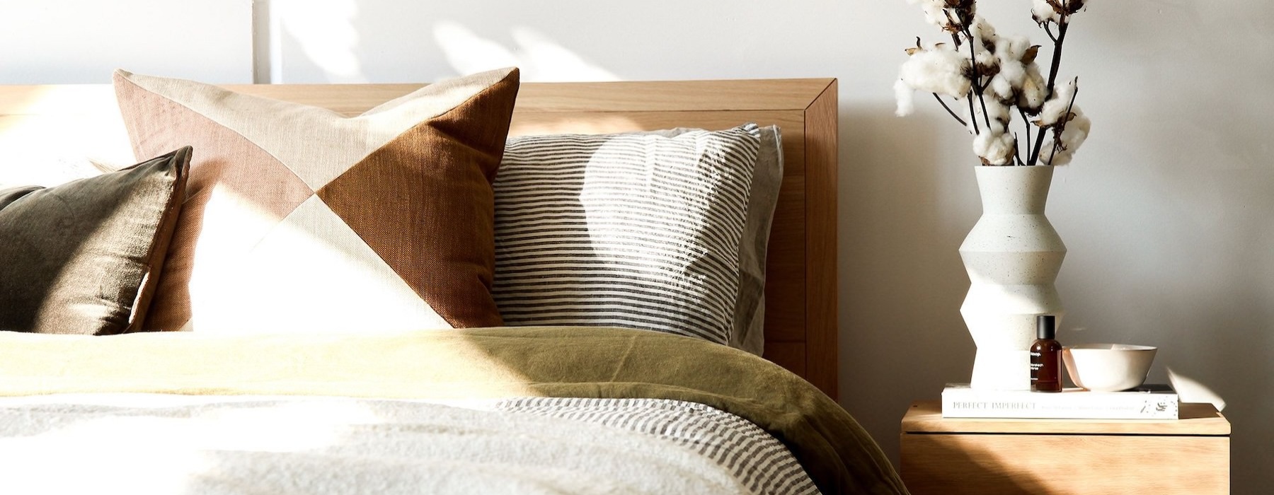 a bedroom with a bed and a nightstand
